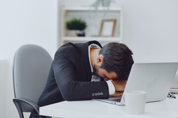 Man business workplace professional tired glasses sitting working thinking office laptop businessman angry desk