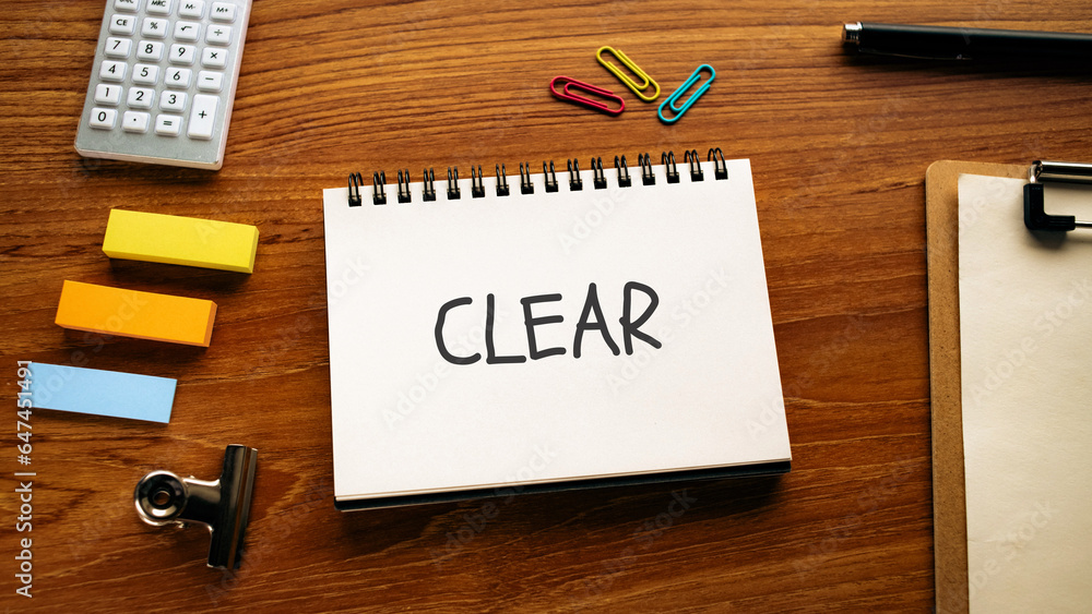 Poster there is notebook with the word clear. it is as an eye-catching image.
