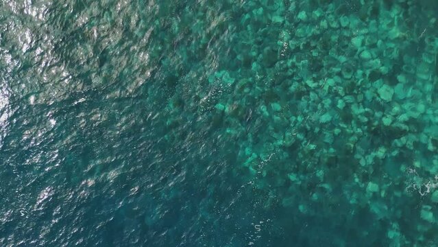 Beautiful waves hitting the Ruins of St. George, S&atilde;o Jorge beach at northeast coast. Blue water on sunny day