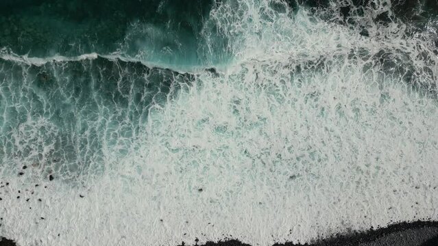 Beautiful waves hitting the Ruins of St. George, S&atilde;o Jorge beach at northeast coast. Blue water on sunny day