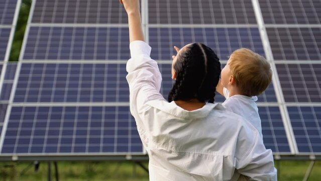 Mother teaching her son about sustainable energy