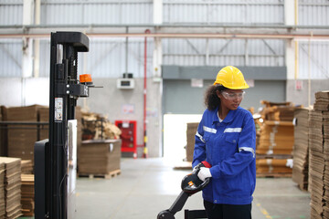 worker or engineer working in factory with safety uniform , safety hat and safety glasses , image is safety concept or happy workplace