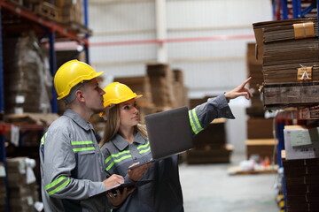 worker or engineer working in factory with safety uniform , safety hat and safety glasses , image is safety concept or happy workplace