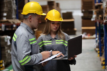 worker or engineer working in factory with safety uniform , safety hat and safety glasses , image is safety concept or happy workplace