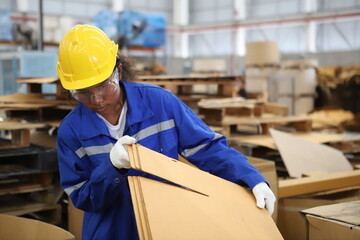 worker or engineer working in factory with safety uniform , safety hat and safety glasses , image is safety concept or happy workplace