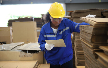 worker or engineer working in factory with safety uniform , safety hat and safety glasses , image is safety concept or happy workplace