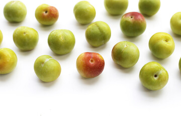 Fresh green plum on white background