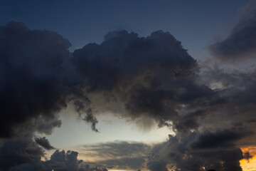 big clouds in the sky at sunset