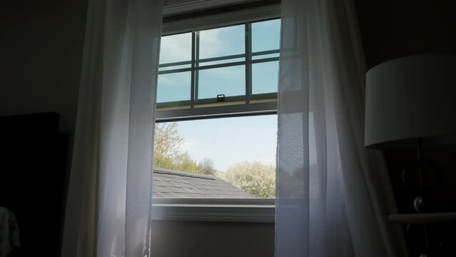 Transparent window curtain, slow moved by the wind