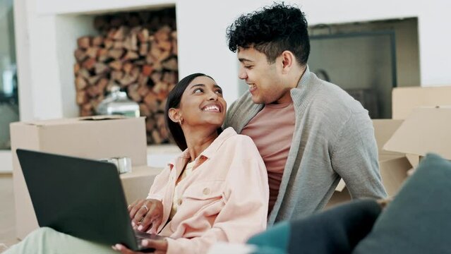 Couple, boxes and laptop in real estate planning, new home or moving in property together or relax on sofa. Man and woman homeowners on computer in renovation, relocation or teamwork for house plan