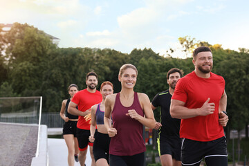 Fototapeta premium Group of people running outdoors. Active lifestyle