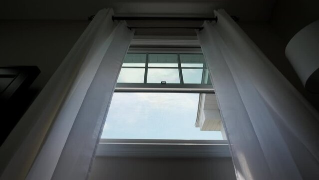 Transparent window curtain, slow moved by the wind. slow motion