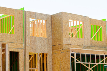 frame and walls of plywood new house wooden development window