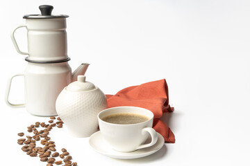 Set of a ceramic coffee cup with coffe maker
