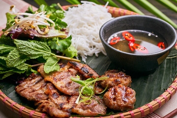 Pan-Asian dish setup on the dark table