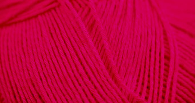 woolen threads of red color for knitting, thin red threads for knitting close-up