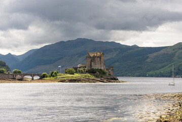 Fototapeta na wymiar Eilean Donan Castle at the confluence of Loch Duich, Loch Long, and Loch Alsh in the Highlands of Scotland.