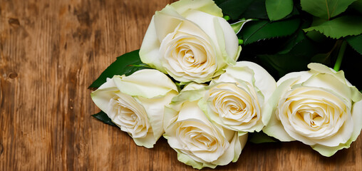 bouquet of white roses On a wooden background a wooden floor flowers represent love