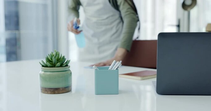 Woman, hands and cleaning desk in service for housekeeping, hygiene and dust on furniture. Cleaner, janitor or maid wiping dirt on table in workplace with cloth, spray bottle and office maintenance.