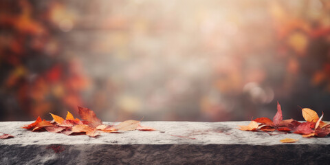 Empty stone texture table. Blurred autumn falling leaves background