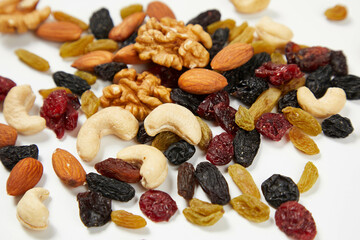 mixed nuts in bowl,Nut foods, various mixed nuts, raisins, walnuts, almonds, black rice, peanuts, milk, vitamin supplement foods