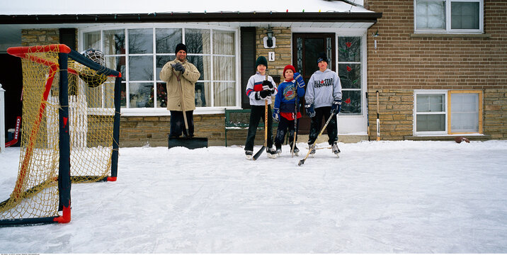 Kids Playing Ice Hockey Outdoors