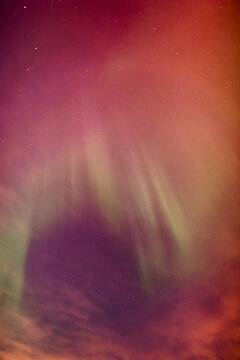 A green and red northern lights corona in the sky above the tony knowles coastal trail in winter; Anchorage alaska united states of america