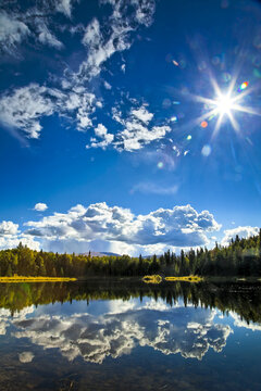 Clouds And Boreal Forest Reflect On 48 Mile Pond, Chena River State Recreation Area; Fairbanks, Alaska, United States Of America