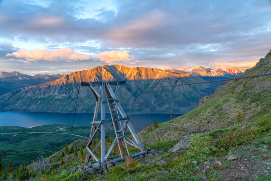 Scenic view of lake and mountains along the Sam McGee Trail with old mining relics, Yukon, Canada