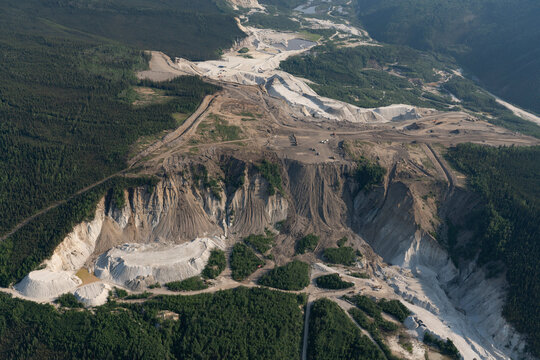 Aerial view of a mine site in the Yukon where the destruction of the land is visible near Dawson City; Dawson City, Yukon, Canada