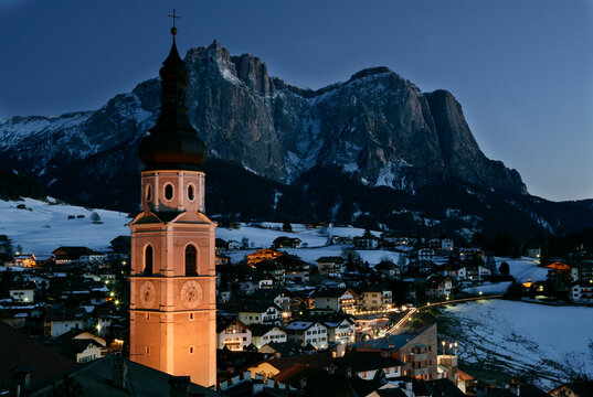 Twilight falls on the village of Castelrotto; Castelrotto, Italy