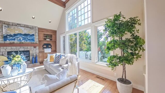 360-degree rotational view of a modern luxury home with a view of the living room, dining and kitchen area, and entryway