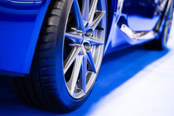 Details about the wheels of a blue super sports car, luxury car