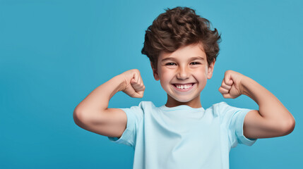happy winner school boy isolated on blue background celebrates new success, power, energy. Yes !
