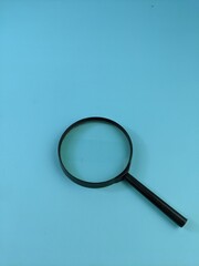 magnifying glass isolated on blue
