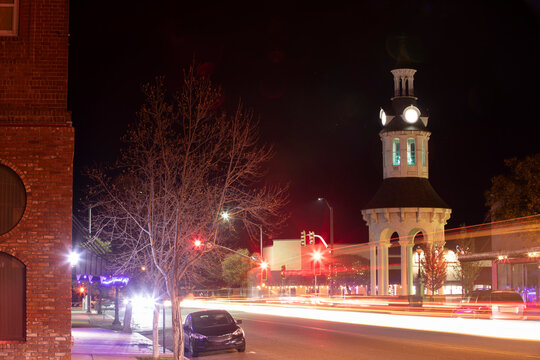 Night time traffic streams through historic downtown Red Bluff, California, USA.