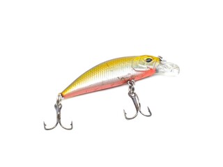 Picture of colorful fish shaped plug baits with 3 way hooks. Fishing equipment isolated on white...