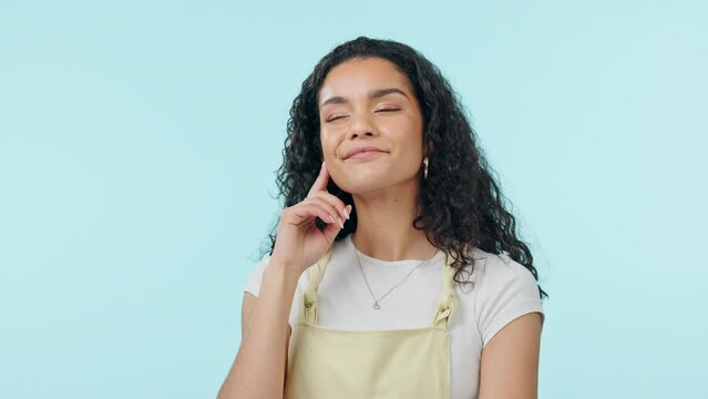 Woman, thinking and ideas with inspiration in studio, dream and future isolated on blue background. Mockup space, thoughtful with decision or choice, young model smile and wondering about solution