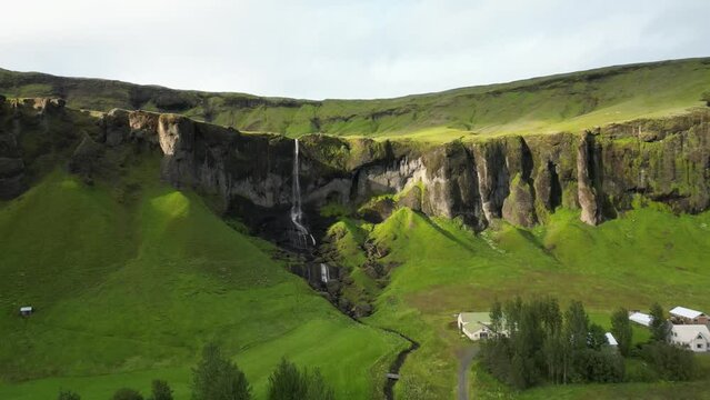 Beautiful waterfall spotted in the back yard, south part of Iceland.
