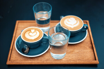 Two cups of coffee with milk