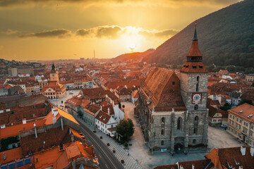 Aerial drone view of the The Black Church in Brasov at sunset, Romania