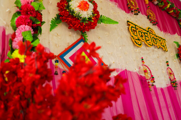 Beautiful Indian wedding ceremony stage set in colors and entrance in red and floral patterns