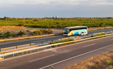 Bus on highway. Tour Bus driving on highway road. Public transport for traveling. Bus travel in Europe. Passenger bus on motorway. Transportation of passengers by public transport by road