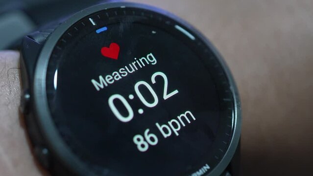 Close up of Garmin smart watch with health app icon monitoring heart rate