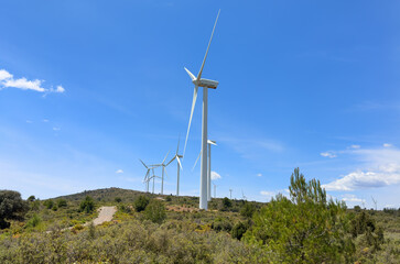 Wind turbine in mountains. Eolic park windpower. Wind farm or New Wind green energy. Wind turbines alternative energy. Windmill power clean electricity generation in Viver, Castell&oacute;n, Caudiel, Spain