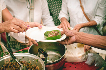 Volunteers help distribute free food to the hungry.
