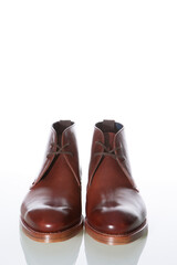 Tanned Derby Boots Made of Calf Leather with Leather Sole Placed In Line With One Another On Pure White