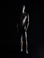 Fototapeta na wymiar full length mannequin on a black background