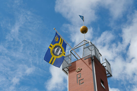 View of one of the towers of the Sj&ucirc;kel&acirc;n in Franeker Friesland The Netherlands during the 170th PC with its logo in the flag. The PC is the most important kaats competition with a long tradition.