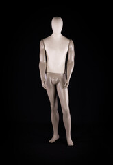 full length mannequin on a black background